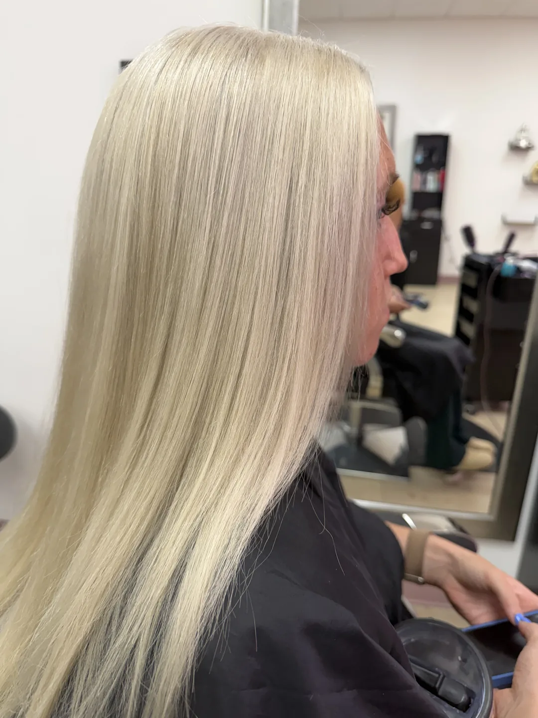 platinum blonde on long sleek hair, side view