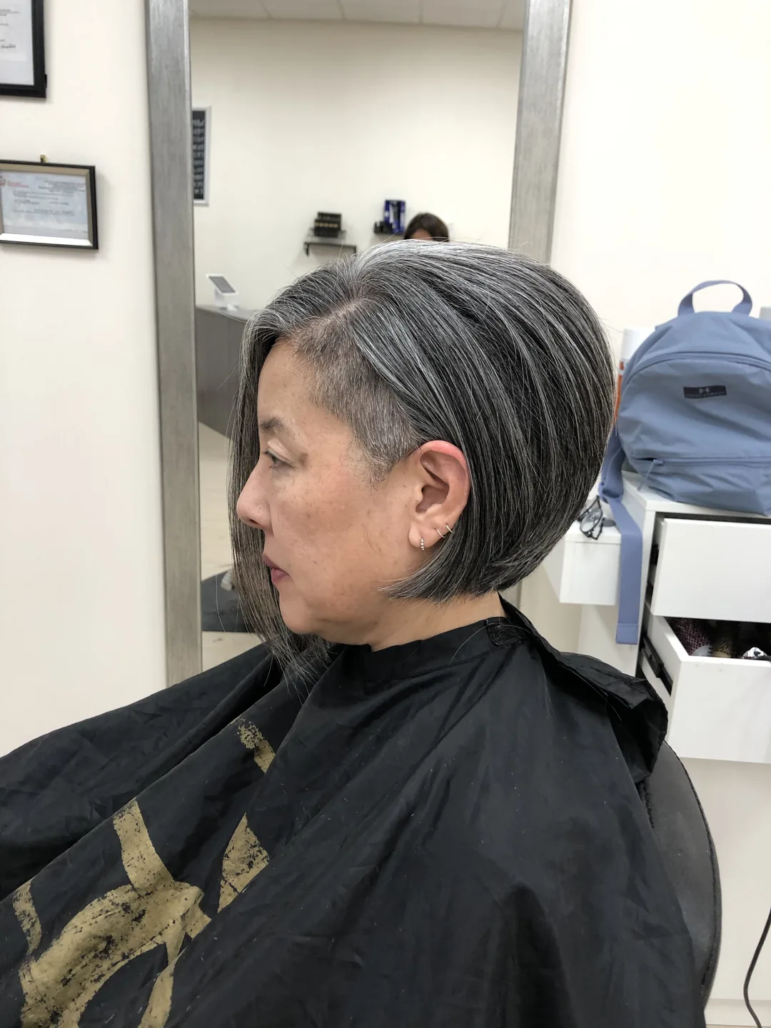 salt-and-pepper short angled bob side-profile