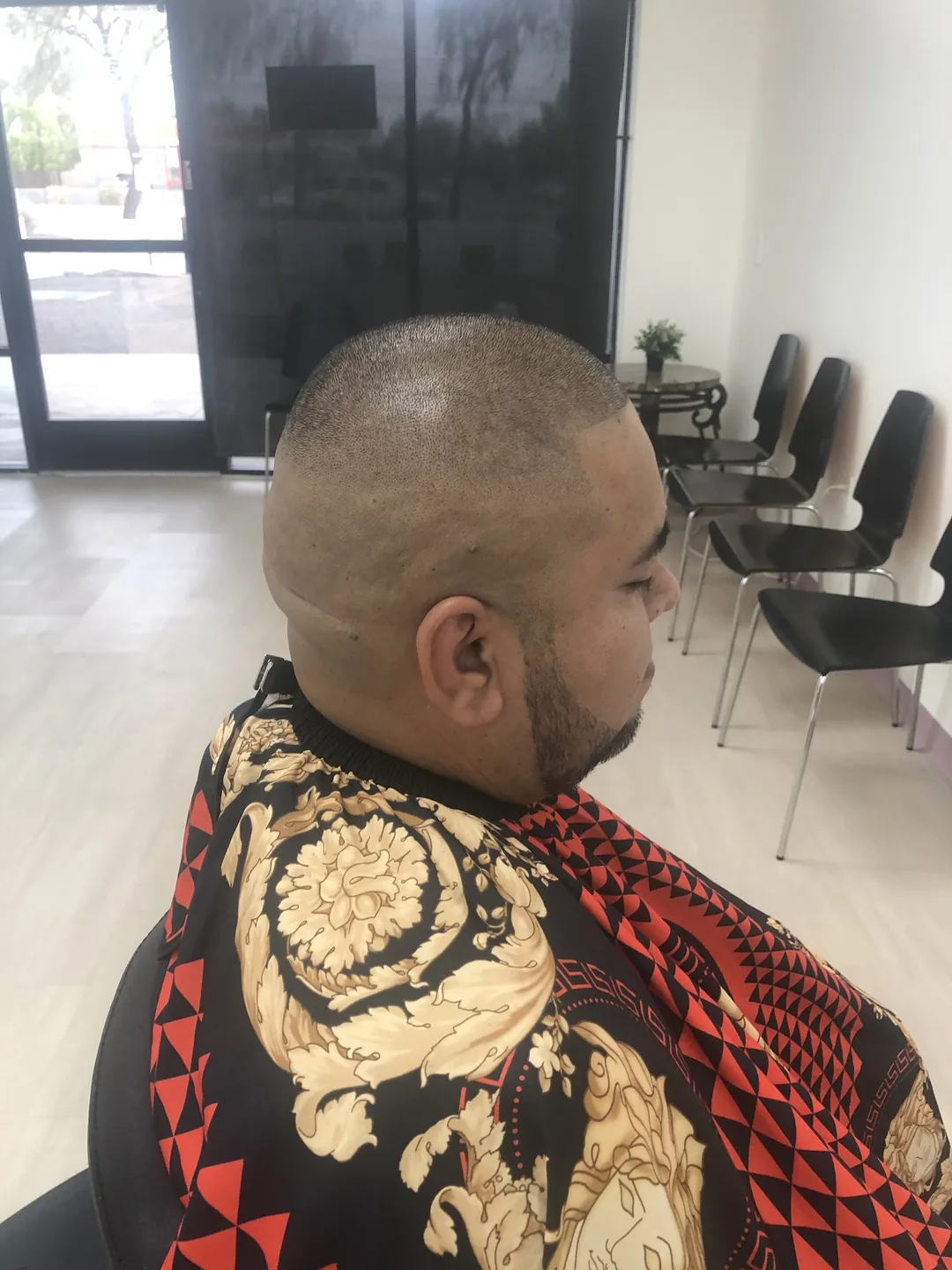 Mens shaved skin fade with beard side profile